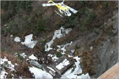 helicopter dropping off supplies in remote site